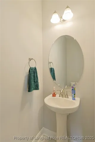 a bathroom with a sink a mirror and vanity
