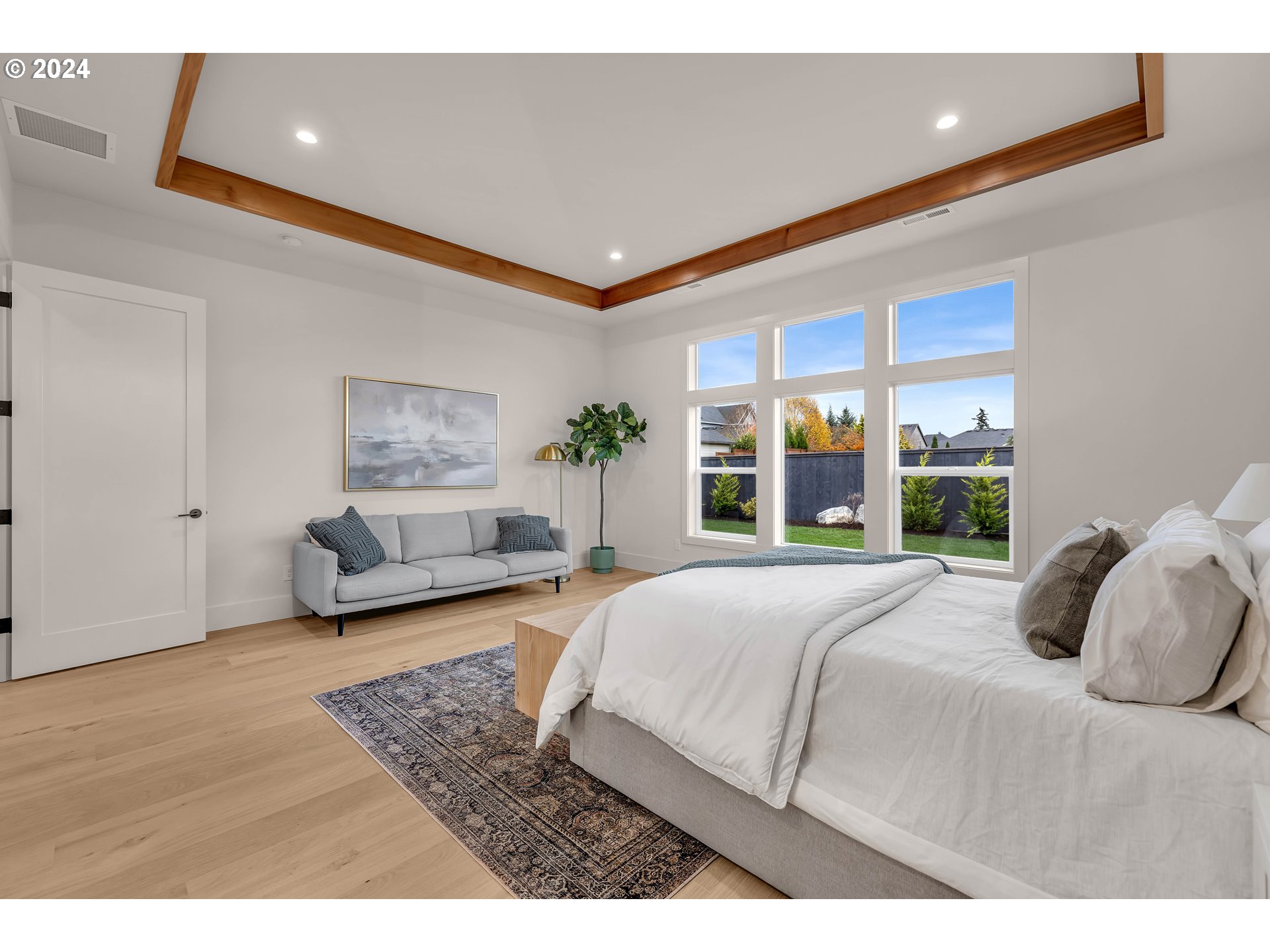 2507 Northeast 178th Street Ridgefield, WA 98642 - Photo 23 of 48 a bedroom with a large bed and a large window