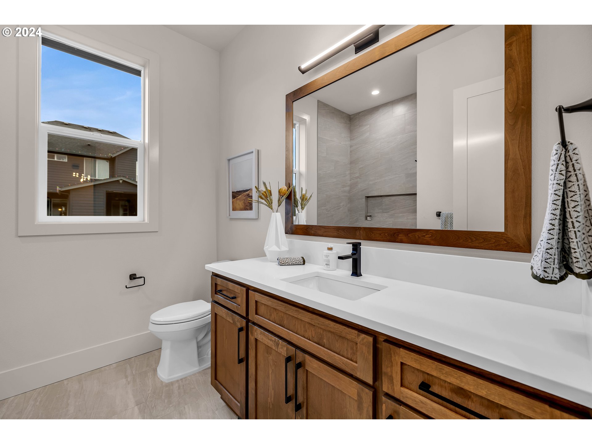2507 Northeast 178th Street Ridgefield, WA 98642 - Photo 40 of 48 a bathroom with a toilet sink and mirror