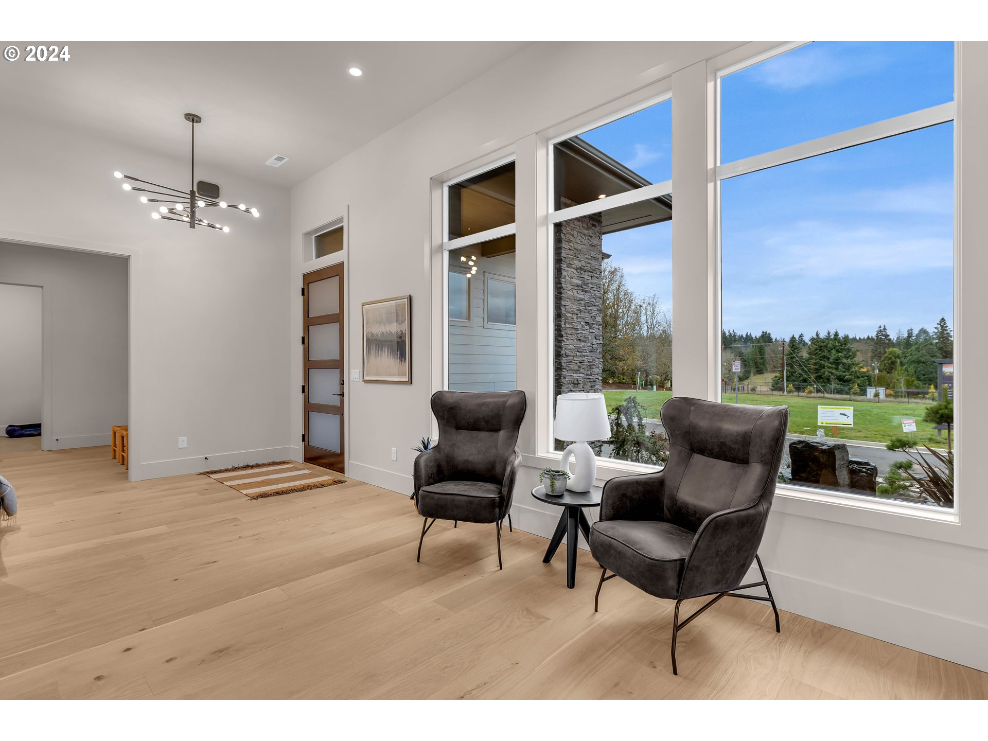 2507 Northeast 178th Street Ridgefield, WA 98642 - Photo 5 of 48 a living room with furniture and a floor to ceiling window