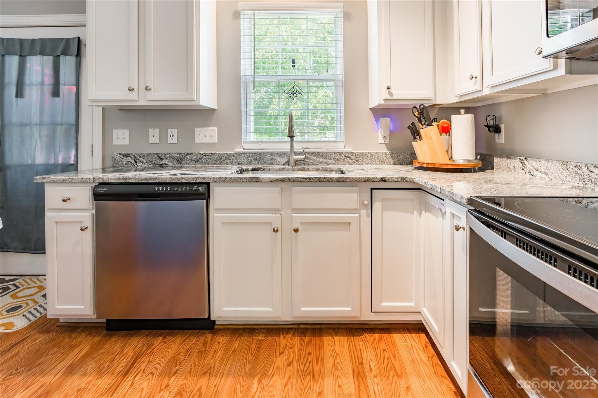 3114 Tanzanite Circle Fort Mill, SC 29708 - Photo 12 of 31 a kitchen with granite countertop a sink cabinets and window