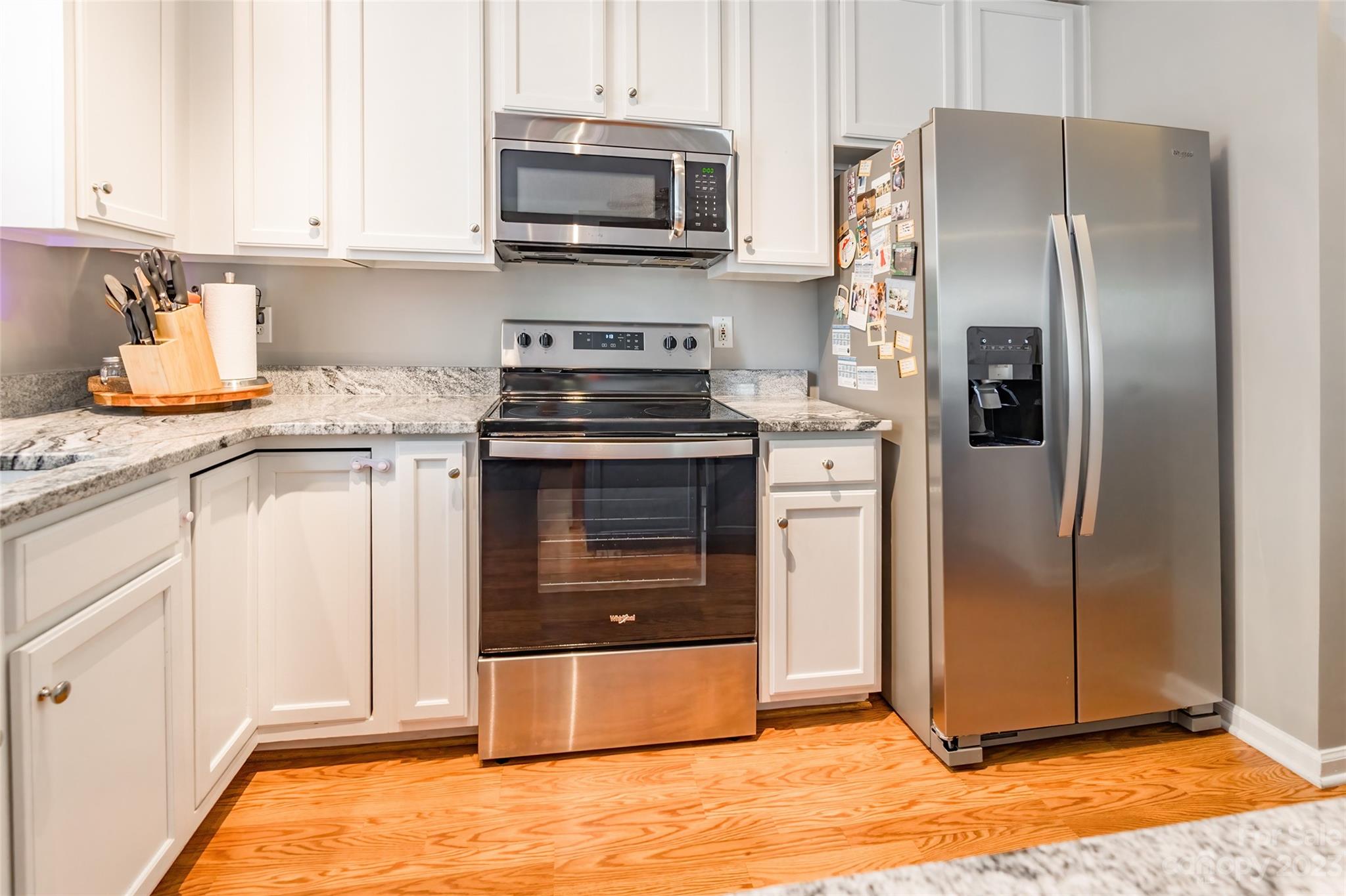 3114 Tanzanite Circle Fort Mill, SC 29708 - Photo 13 of 31 a kitchen with stainless steel appliances granite countertop a refrigerator stove and sink