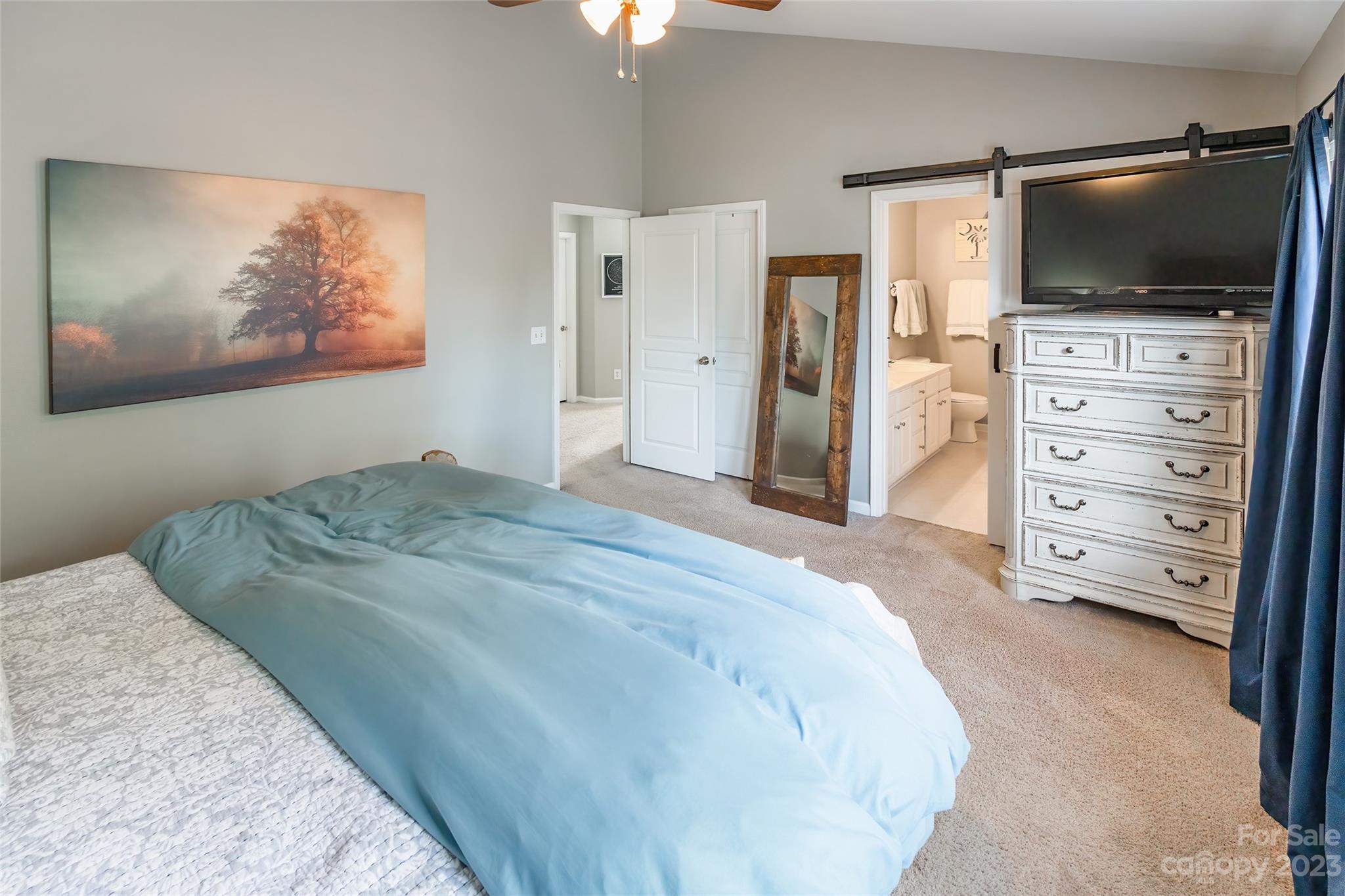 3114 Tanzanite Circle Fort Mill, SC 29708 - Photo 16 of 31 a bedroom with a bed and a flat screen tv