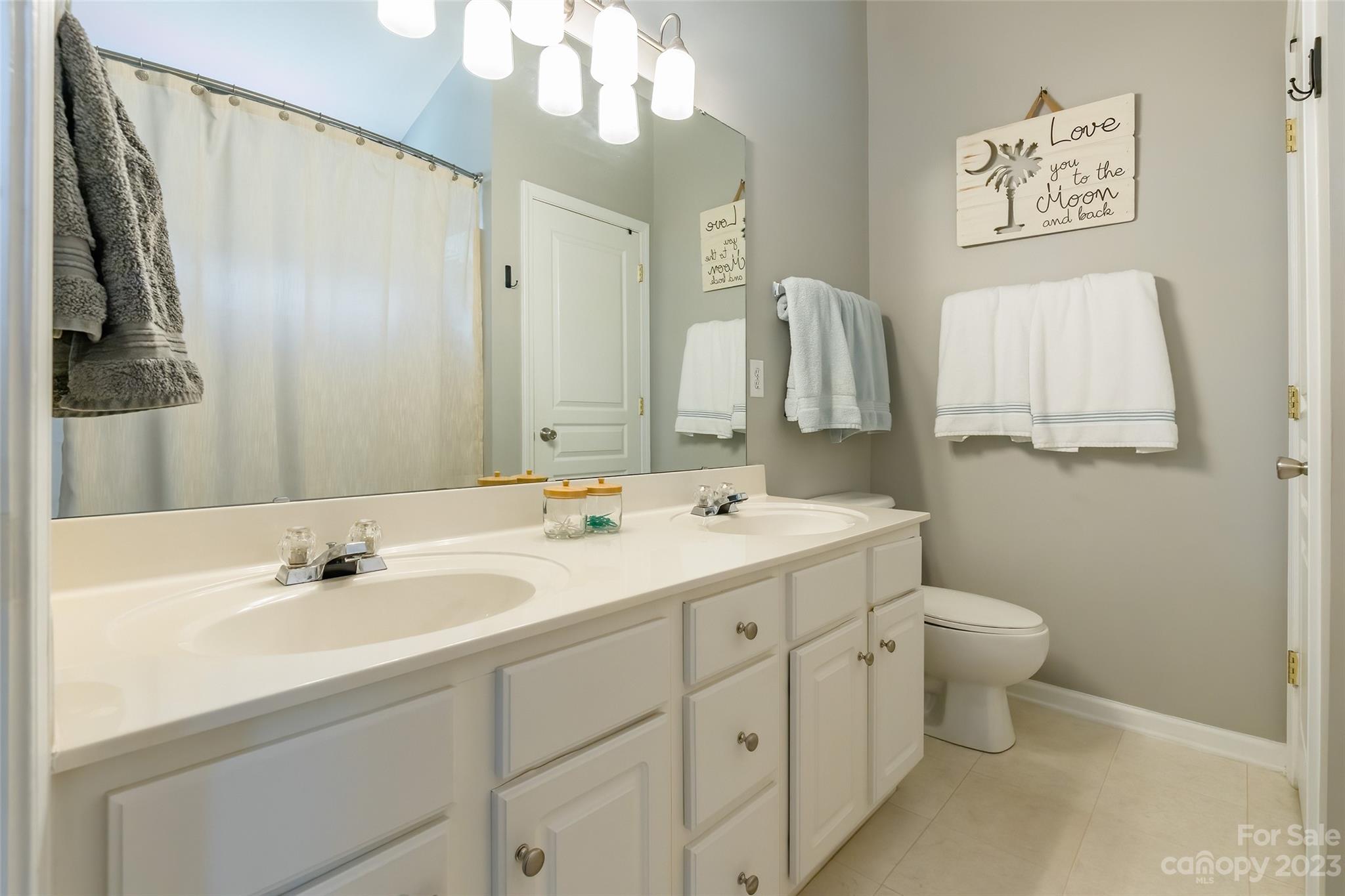 3114 Tanzanite Circle Fort Mill, SC 29708 - Photo 17 of 31 a bathroom with a sink double vanity and a mirror