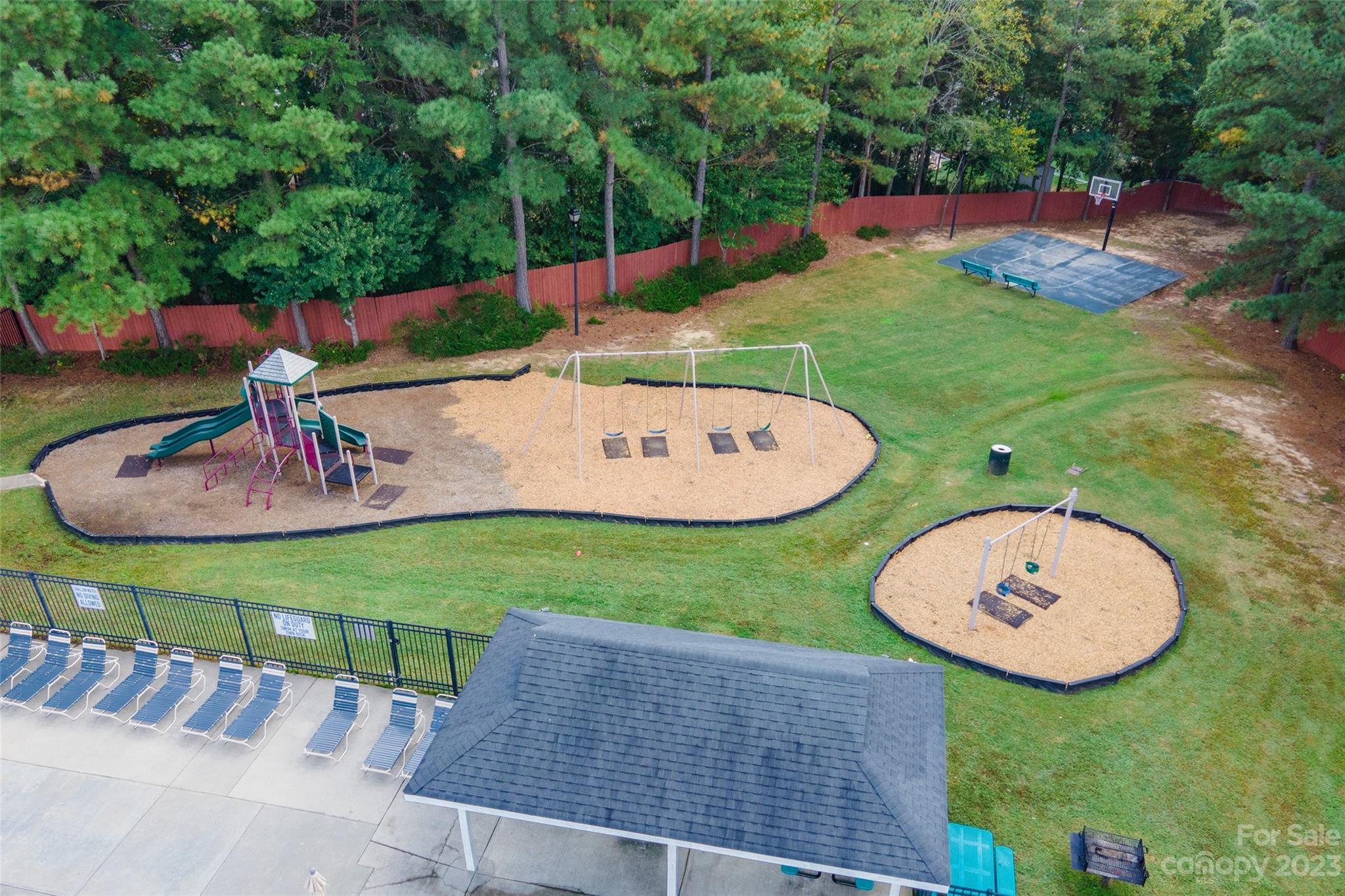 3114 Tanzanite Circle Fort Mill, SC 29708 - Photo 31 of 31 a view of a backyard with a patio and a garden