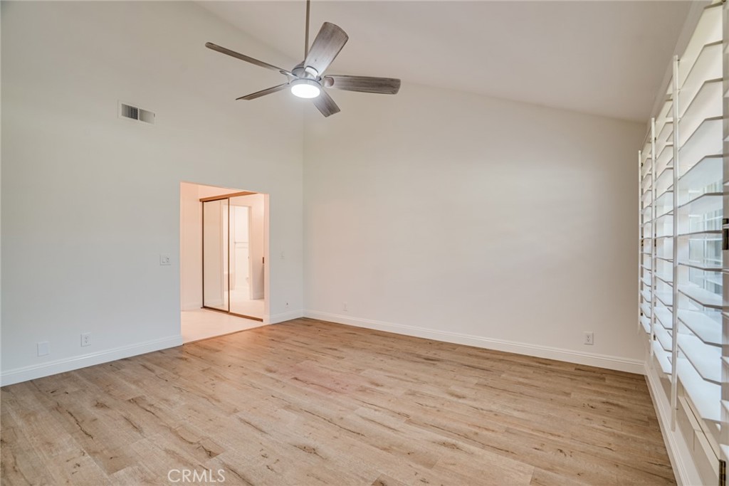 49 East Yale Loop, Unit 26 Irvine, CA 92604 - Photo 34 of 63 wooden floor in an empty room with a window