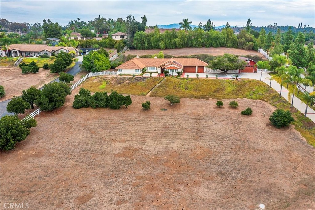 an aerial view of a house with a garden