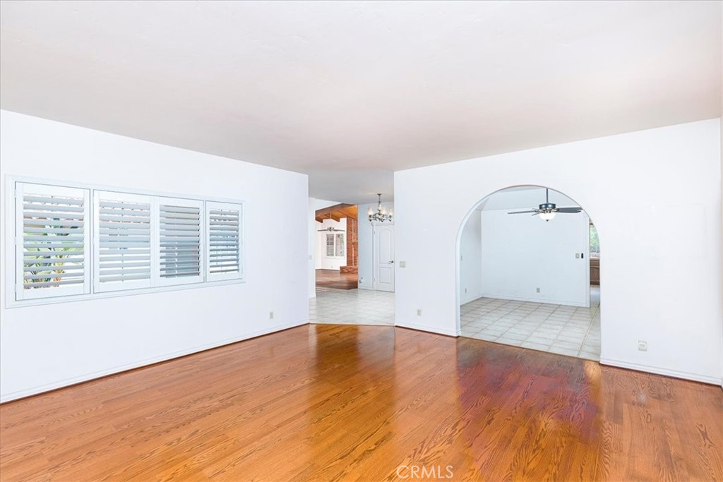 1766 Rabbit Hill Fallbrook, CA 92028 - Photo 17 of 75 an empty room with wooden floor and windows