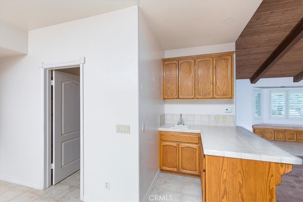 1766 Rabbit Hill Fallbrook, CA 92028 - Photo 21 of 75 a kitchen with a sink a stove and cabinets