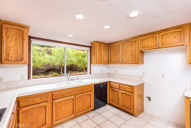 a large spacious bathroom with a large tub and sink