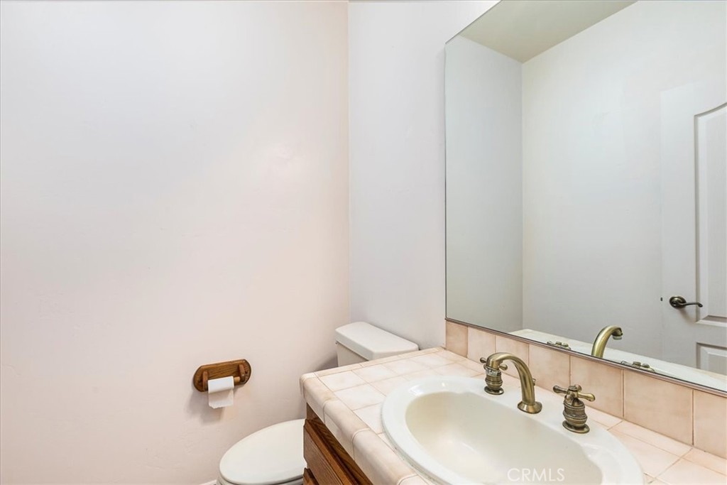 1766 Rabbit Hill Fallbrook, CA 92028 - Photo 27 of 75 a bathroom with a sink and a mirror