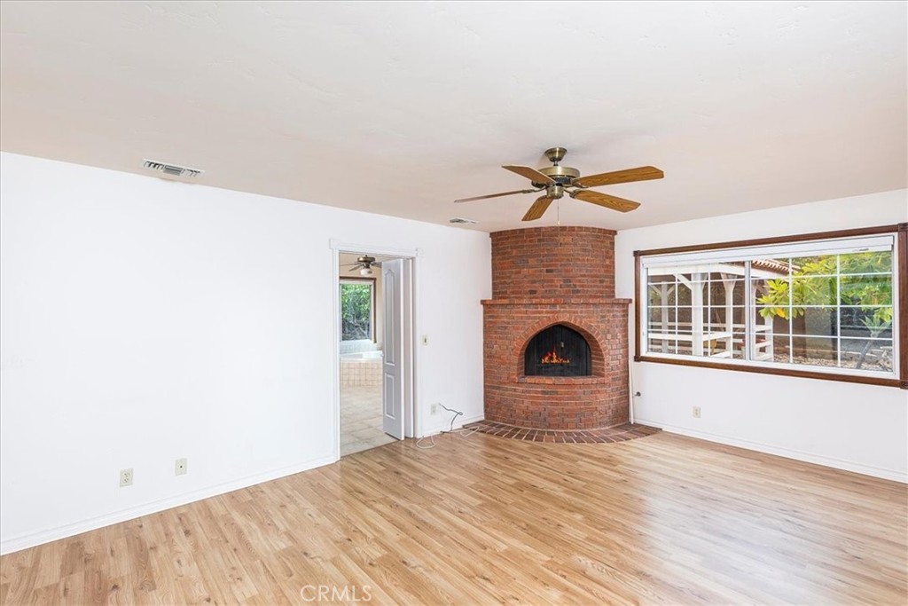 1766 Rabbit Hill Fallbrook, CA 92028 - Photo 30 of 75 a view of empty room with a fireplace and fan