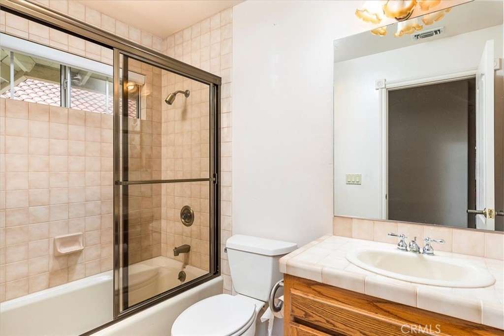 1766 Rabbit Hill Fallbrook, CA 92028 - Photo 36 of 75 a bathroom with a sink toilet and shower