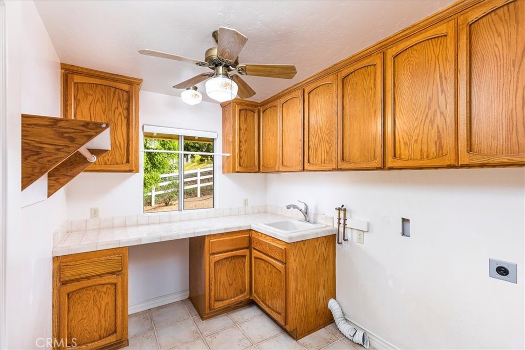 1766 Rabbit Hill Fallbrook, CA 92028 - Photo 42 of 75 a kitchen with a sink cabinets and window