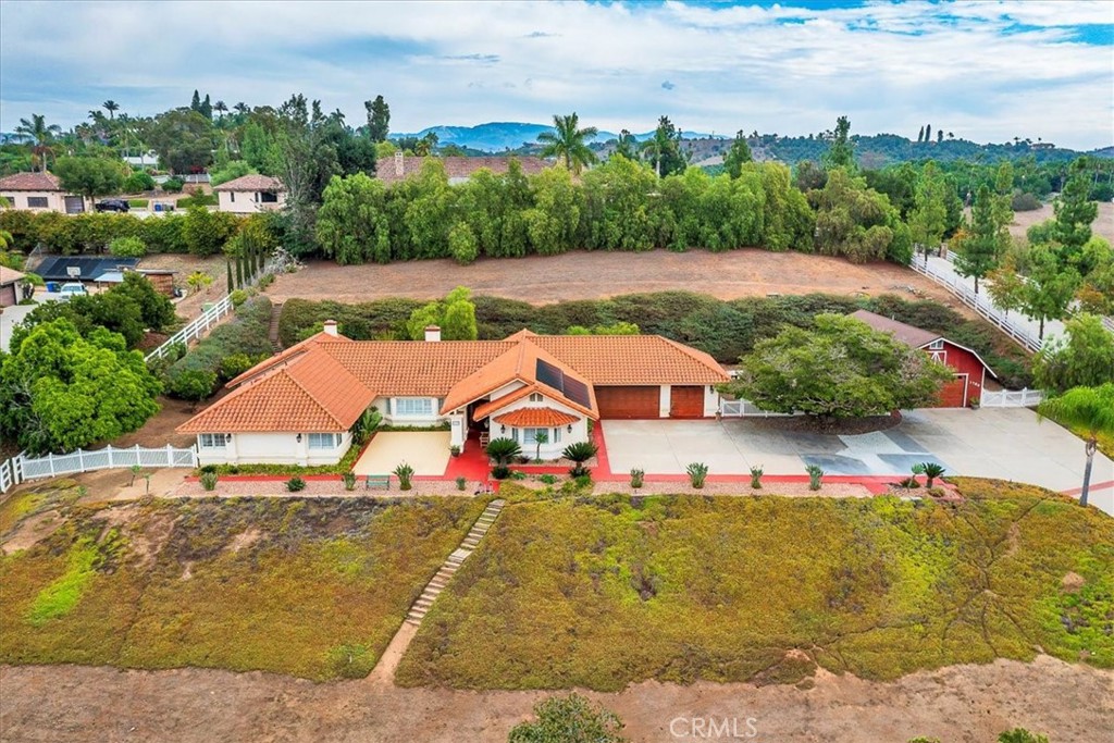 1766 Rabbit Hill Fallbrook, CA 92028 - Photo 5 of 75 an aerial view of a house with a garden and lake view