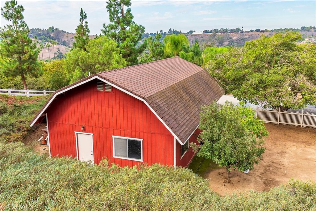 1766 Rabbit Hill Fallbrook, CA 92028 - Photo 59 of 75 a view of a house with a yard and plant