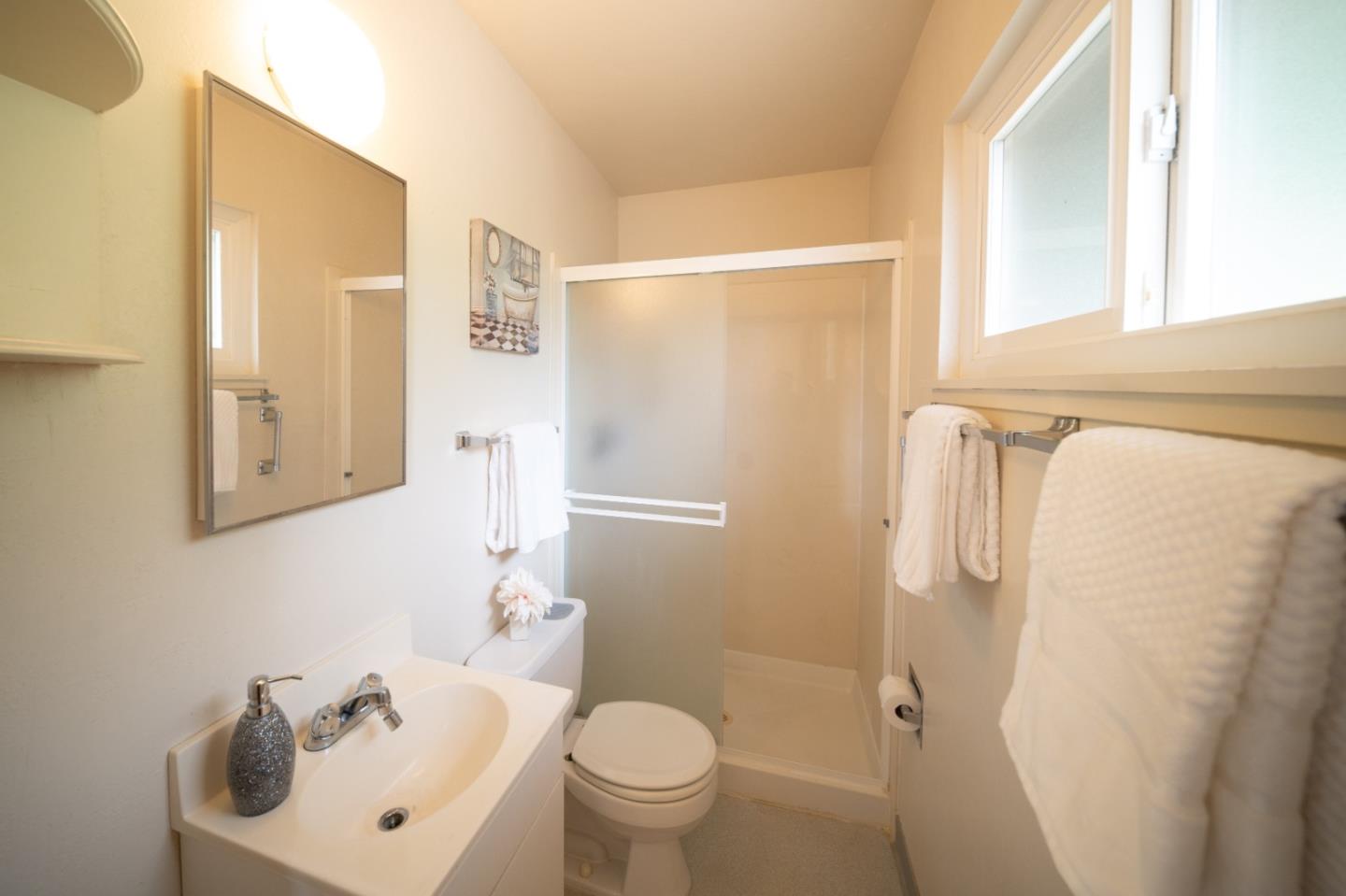 1287 Lerida Way Pacifica, CA 94044 - Photo 34 of 52 a white toilet sitting next to a bathroom sink