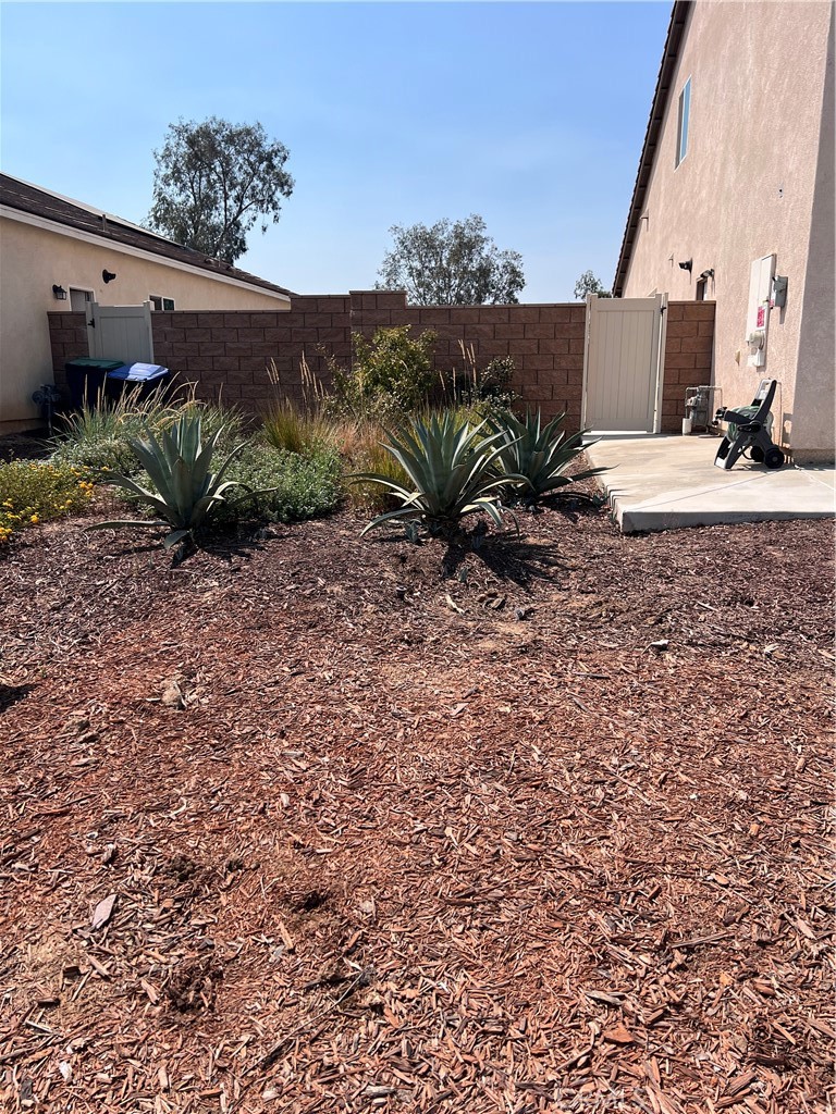 31381 Linden Flower Road Winchester, CA 92596 - Photo 27 of 33 View from sidewalk to side yard area where RV access possible.