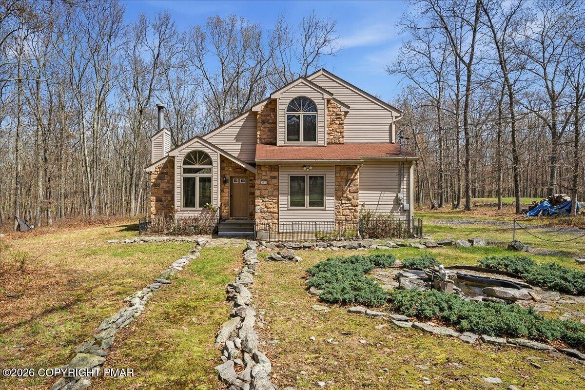 3176 Bluebird Drive Bushkill, PA 18324 - Photo 1 of 37 a front view of a house with a yard