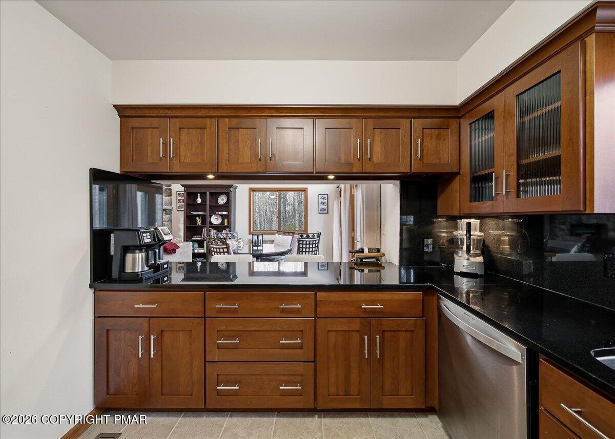 3176 Bluebird Drive Bushkill, PA 18324 - Photo 12 of 37 a kitchen with granite countertop a sink cabinets and stainless steel appliances