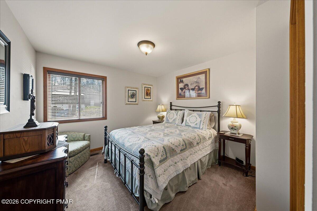 3176 Bluebird Drive Bushkill, PA 18324 - Photo 16 of 37 a bedroom with a bed and a window