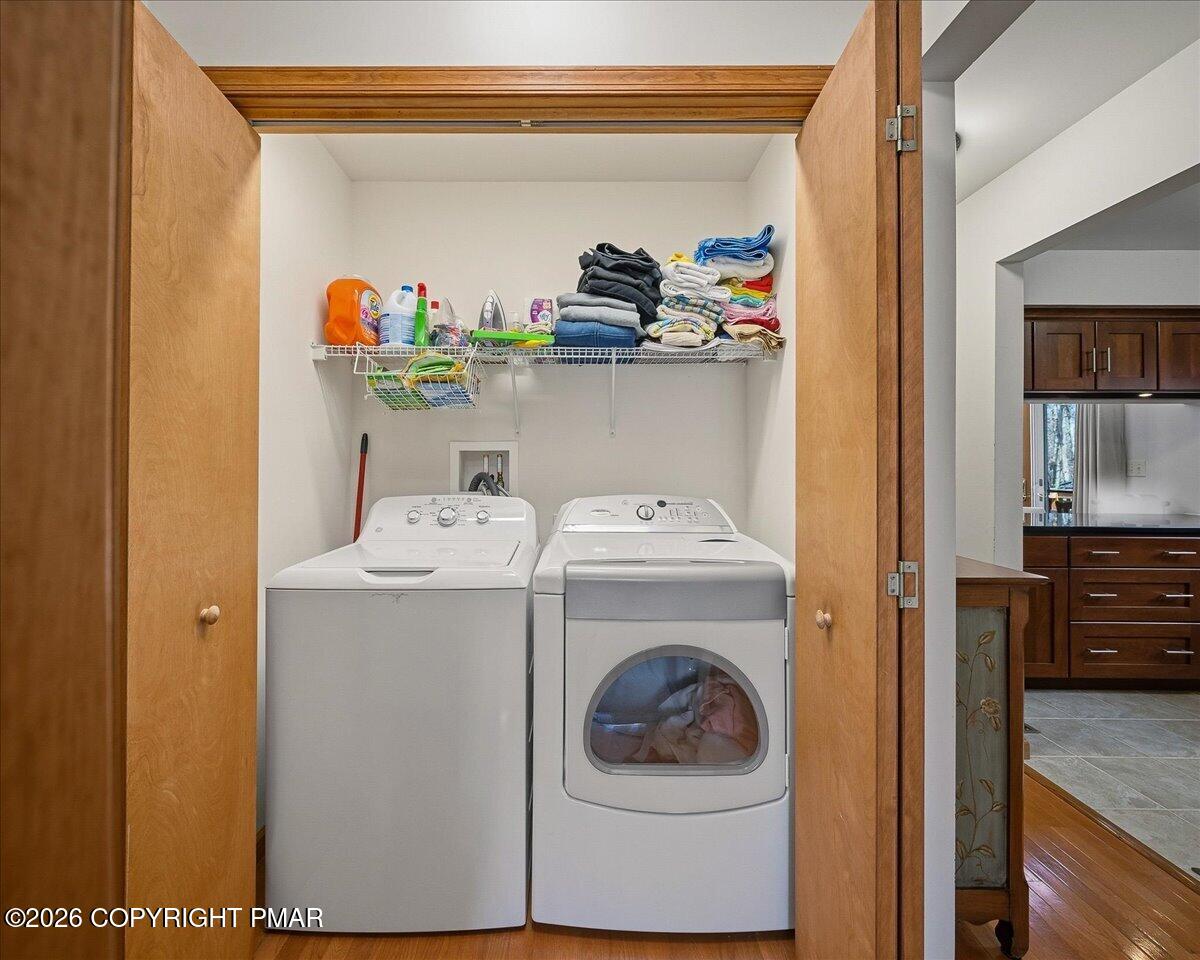 3176 Bluebird Drive Bushkill, PA 18324 - Photo 19 of 37 a utility room with dryer and washer