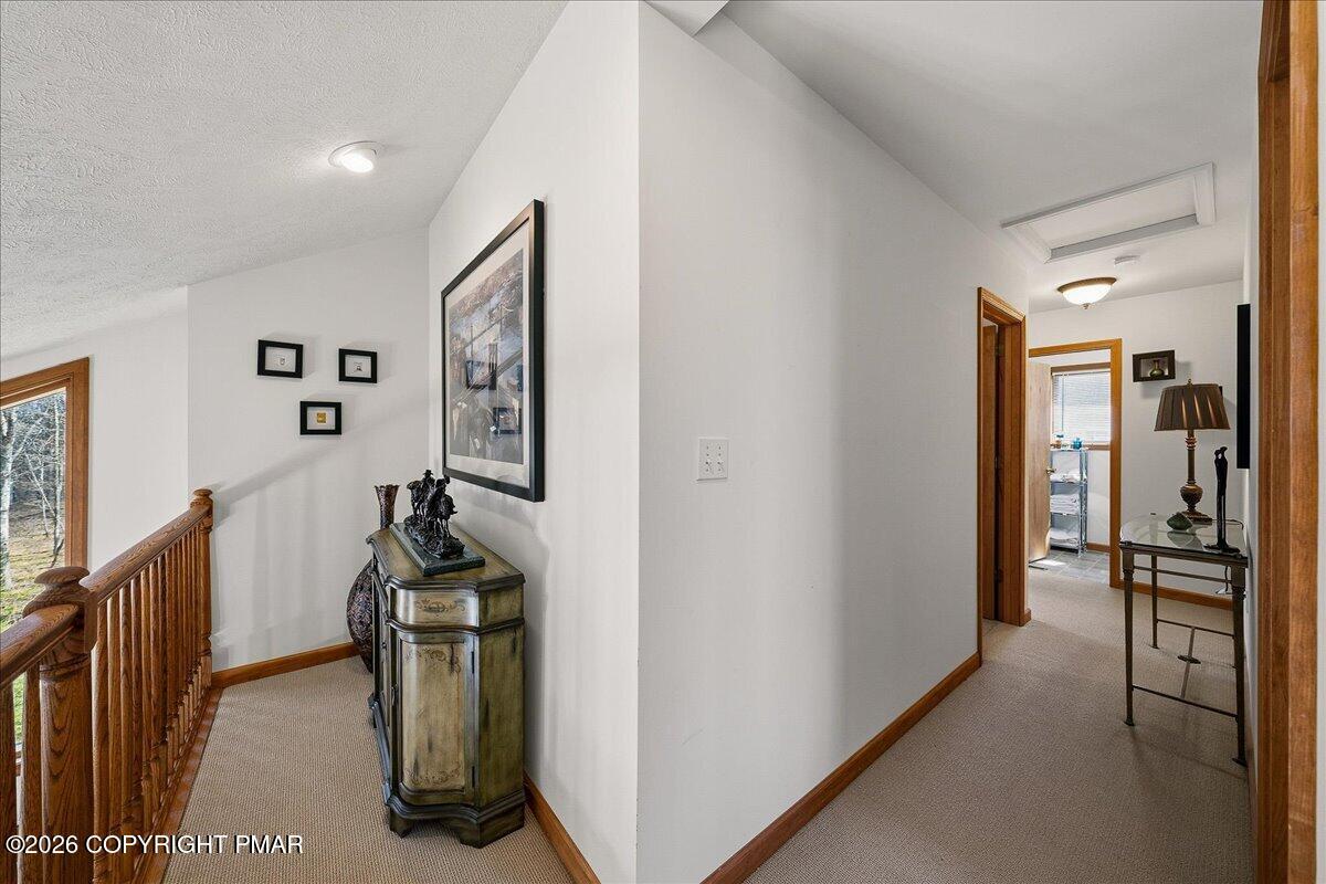 3176 Bluebird Drive Bushkill, PA 18324 - Photo 20 of 37 a view of hallway with livingroom and furniture