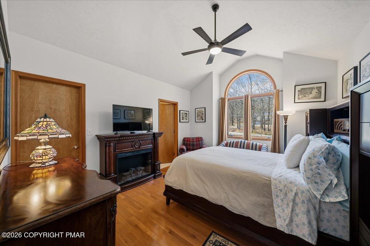 3176 Bluebird Drive Bushkill, PA 18324 - Photo 21 of 37 a bedroom with a bed and a flat tv screen on dresser