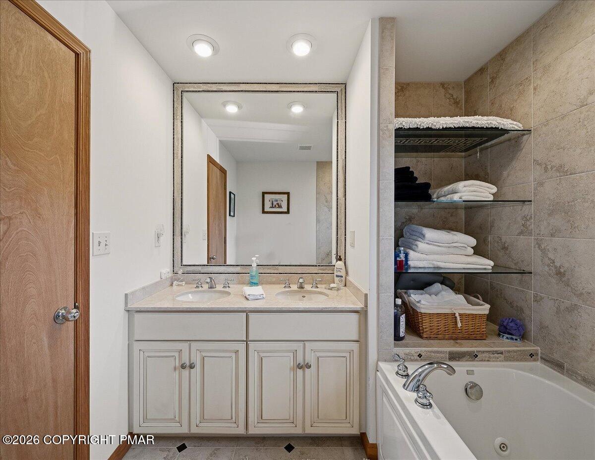 3176 Bluebird Drive Bushkill, PA 18324 - Photo 24 of 37 a bathroom with a sink a toilet and shower