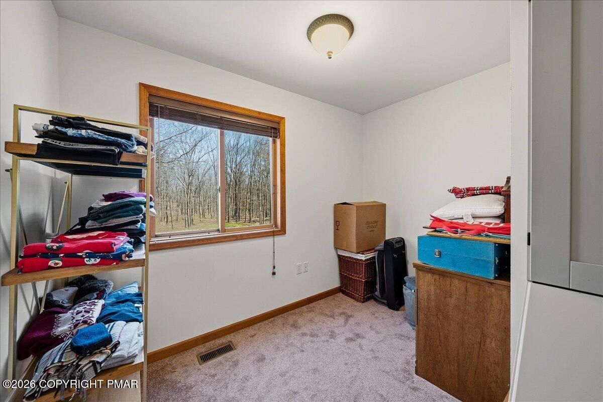 3176 Bluebird Drive Bushkill, PA 18324 - Photo 27 of 37 a bedroom with a bed and a window