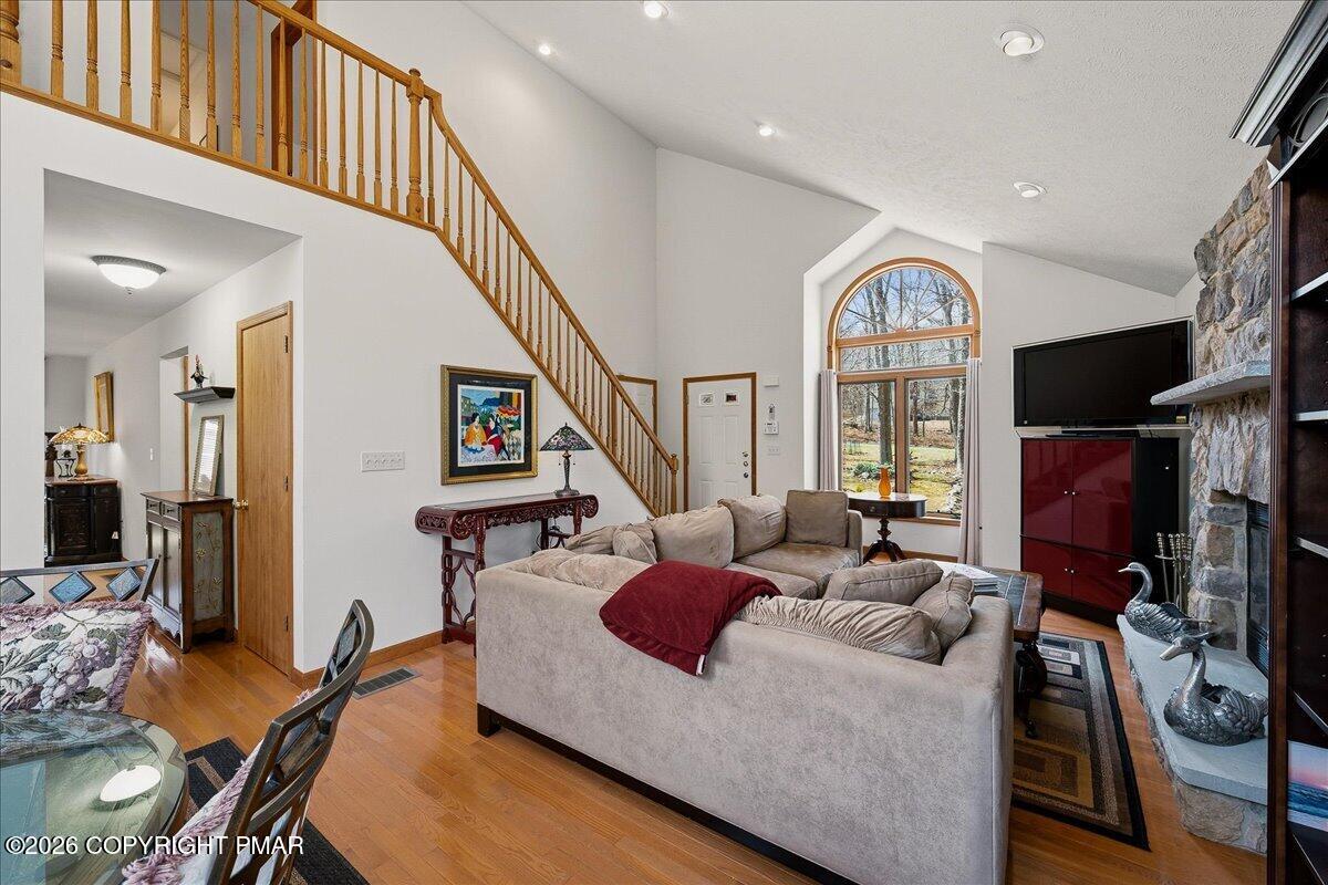 3176 Bluebird Drive Bushkill, PA 18324 - Photo 5 of 37 a living room with furniture fireplace and a flat screen tv