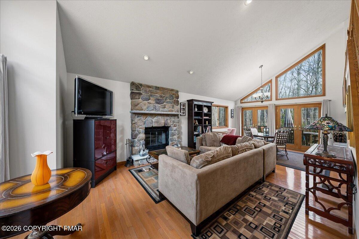 3176 Bluebird Drive Bushkill, PA 18324 - Photo 7 of 37 a living room with furniture and a fireplace