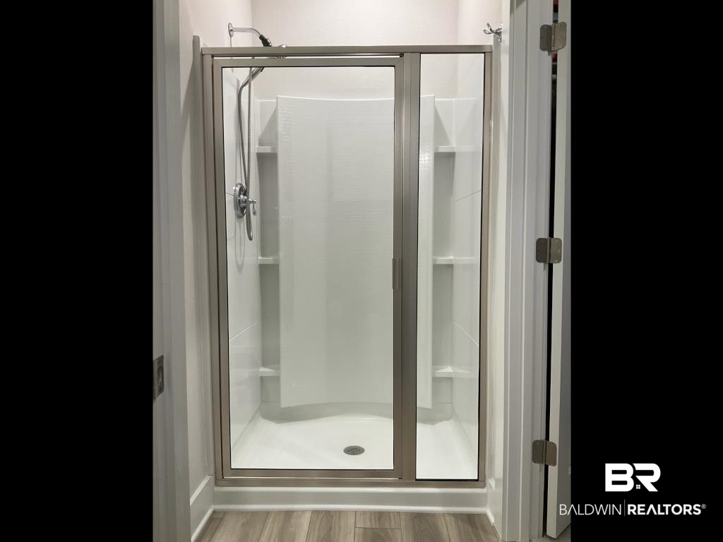 1093 Pheasant Circle Foley, AL 36535 - Photo 13 of 25 Full bathroom with a stall shower and light wood finished floors
