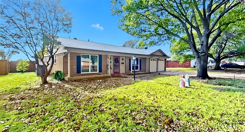 5016 St Lawrence Road Fort Worth, TX 76103 - Photo 2 of 22 a house that has a tree in front of it