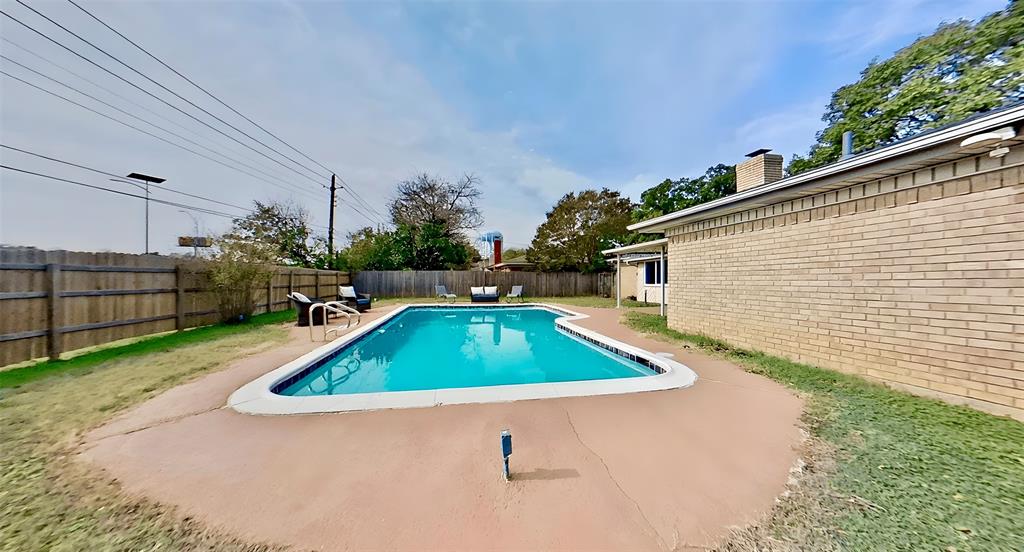 5016 St Lawrence Road Fort Worth, TX 76103 - Photo 21 of 22 a house view with a swimming pool and outdoor space