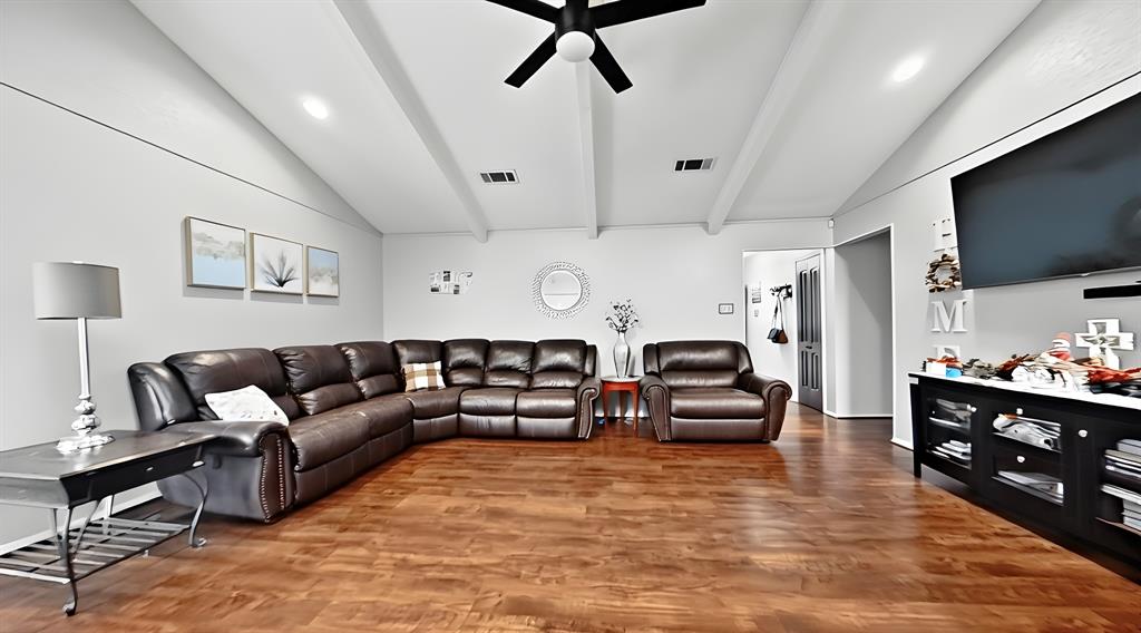 5016 St Lawrence Road Fort Worth, TX 76103 - Photo 4 of 22 a living room with furniture and a flat screen tv