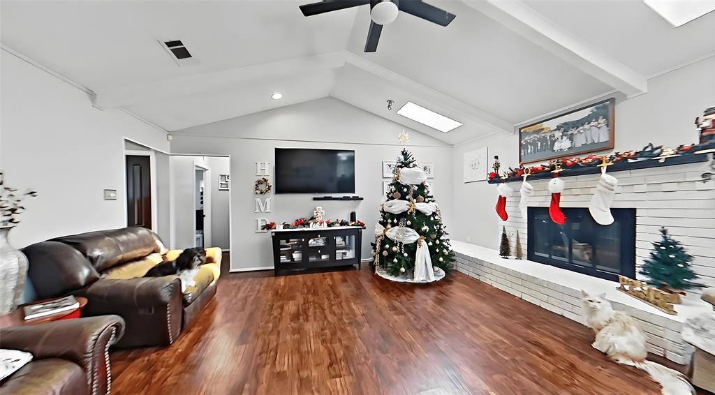 5016 St Lawrence Road Fort Worth, TX 76103 - Photo 5 of 22 a living room with furniture and a flat screen tv