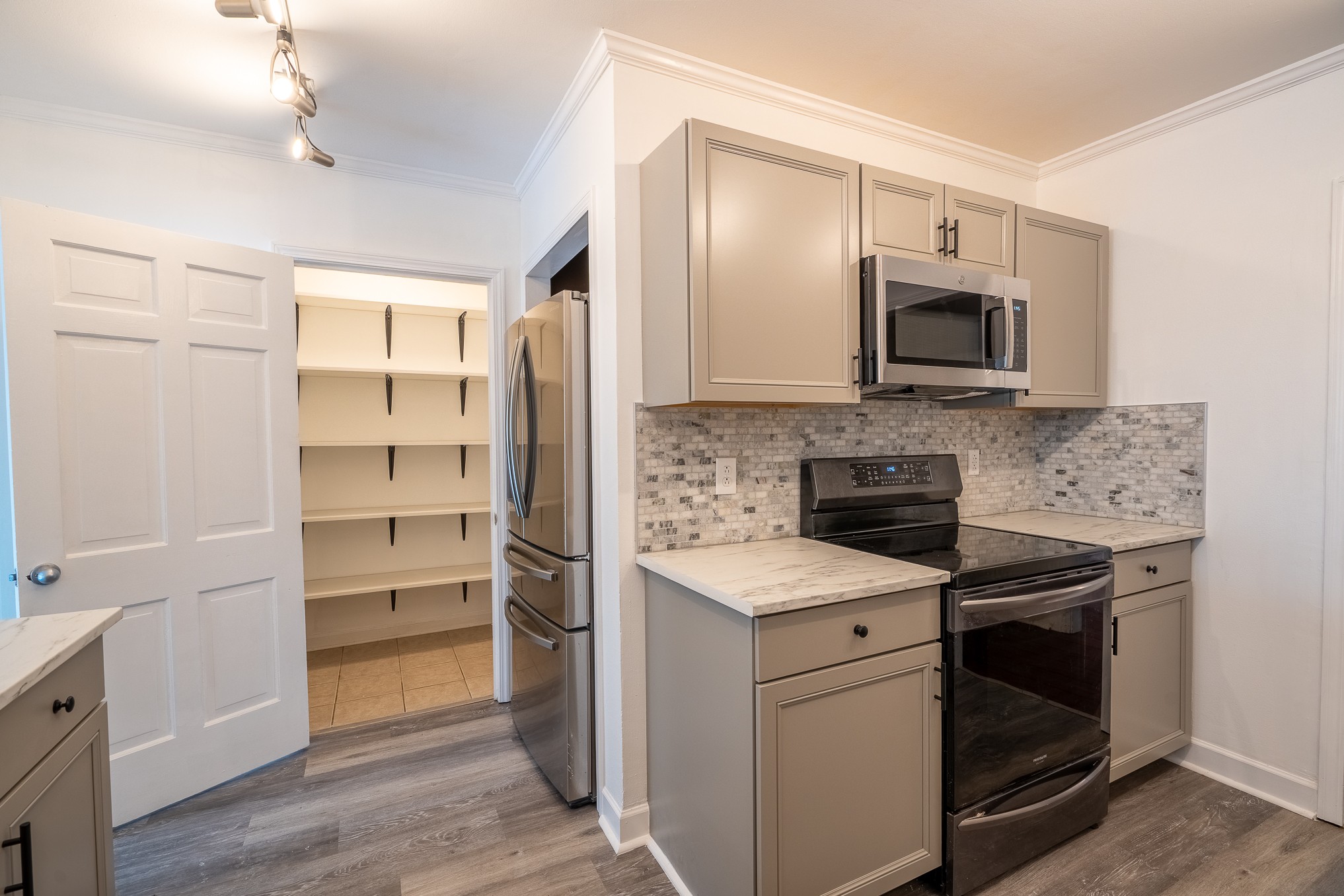 523 Highland Avenue Pulaski, TN 38478 - Photo 14 of 44 a kitchen with a sink stove and microwave
