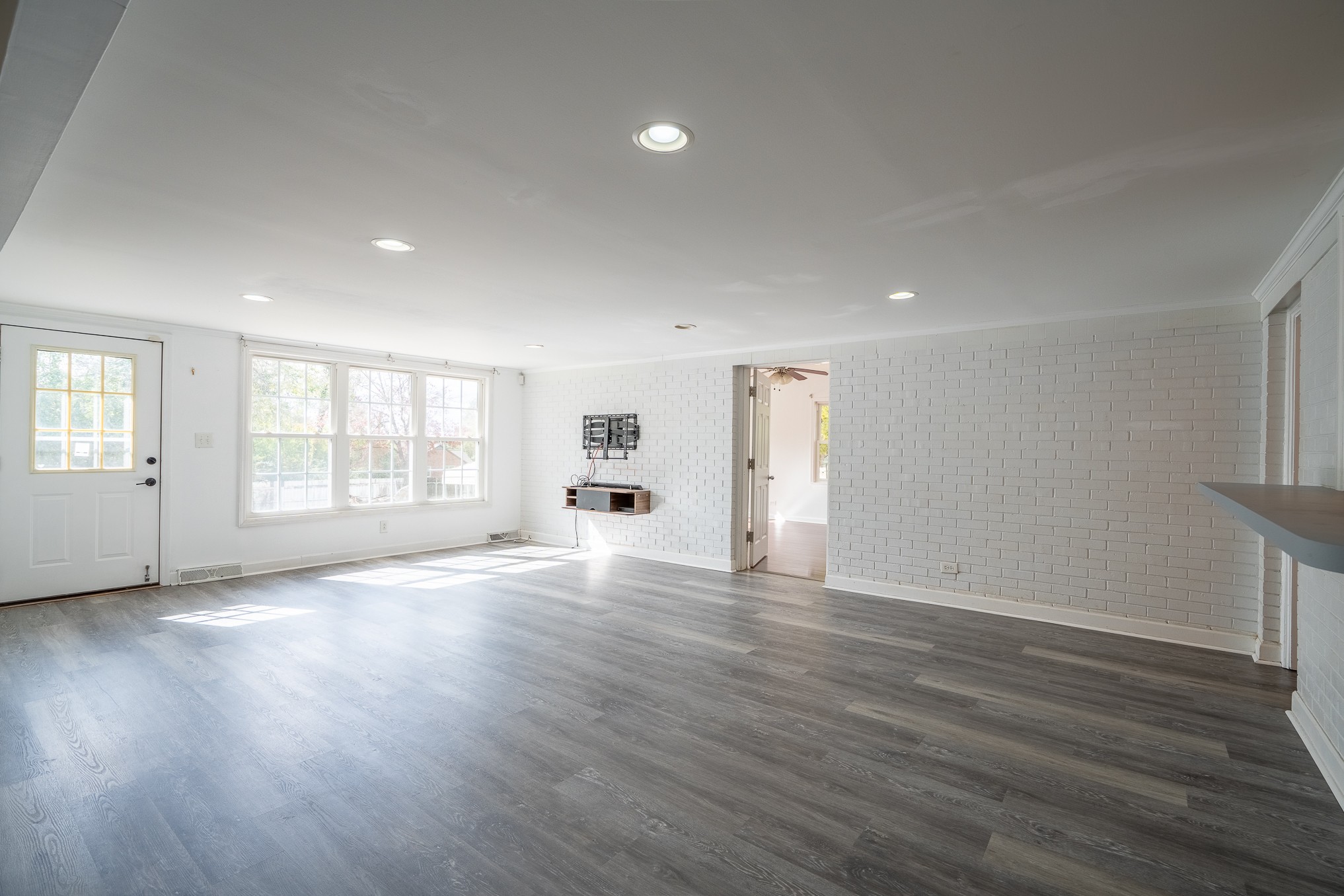 523 Highland Avenue Pulaski, TN 38478 - Photo 18 of 44 a view of empty room with wooden floor and fan