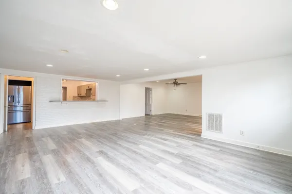 a bedroom with a bed couch and a window