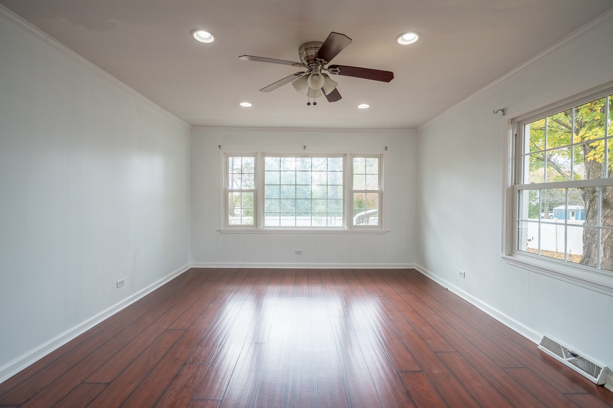 523 Highland Avenue Pulaski, TN 38478 - Photo 23 of 44 an empty room with wooden floor and windows
