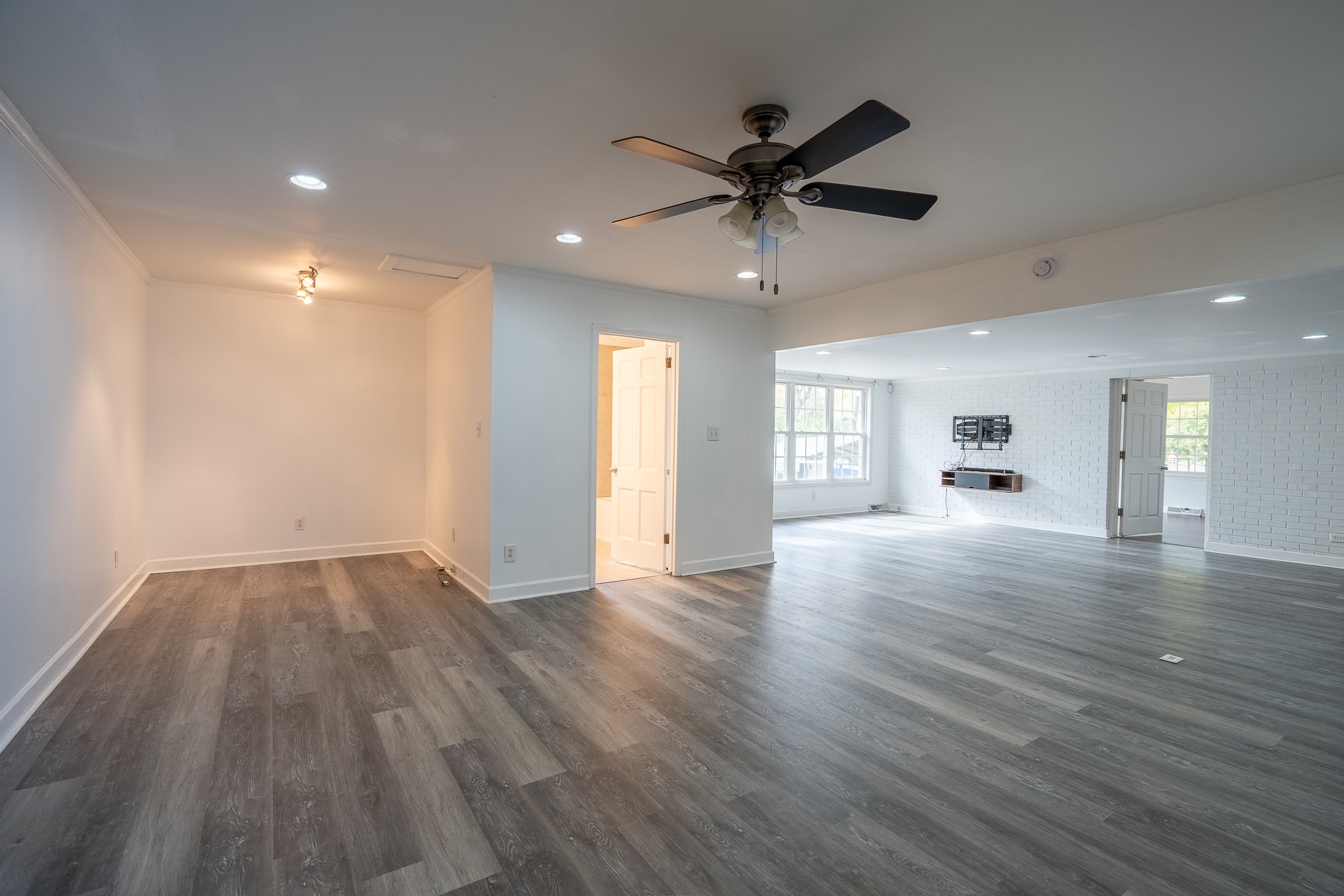 523 Highland Avenue Pulaski, TN 38478 - Photo 33 of 44 an empty room with wooden floor and windows