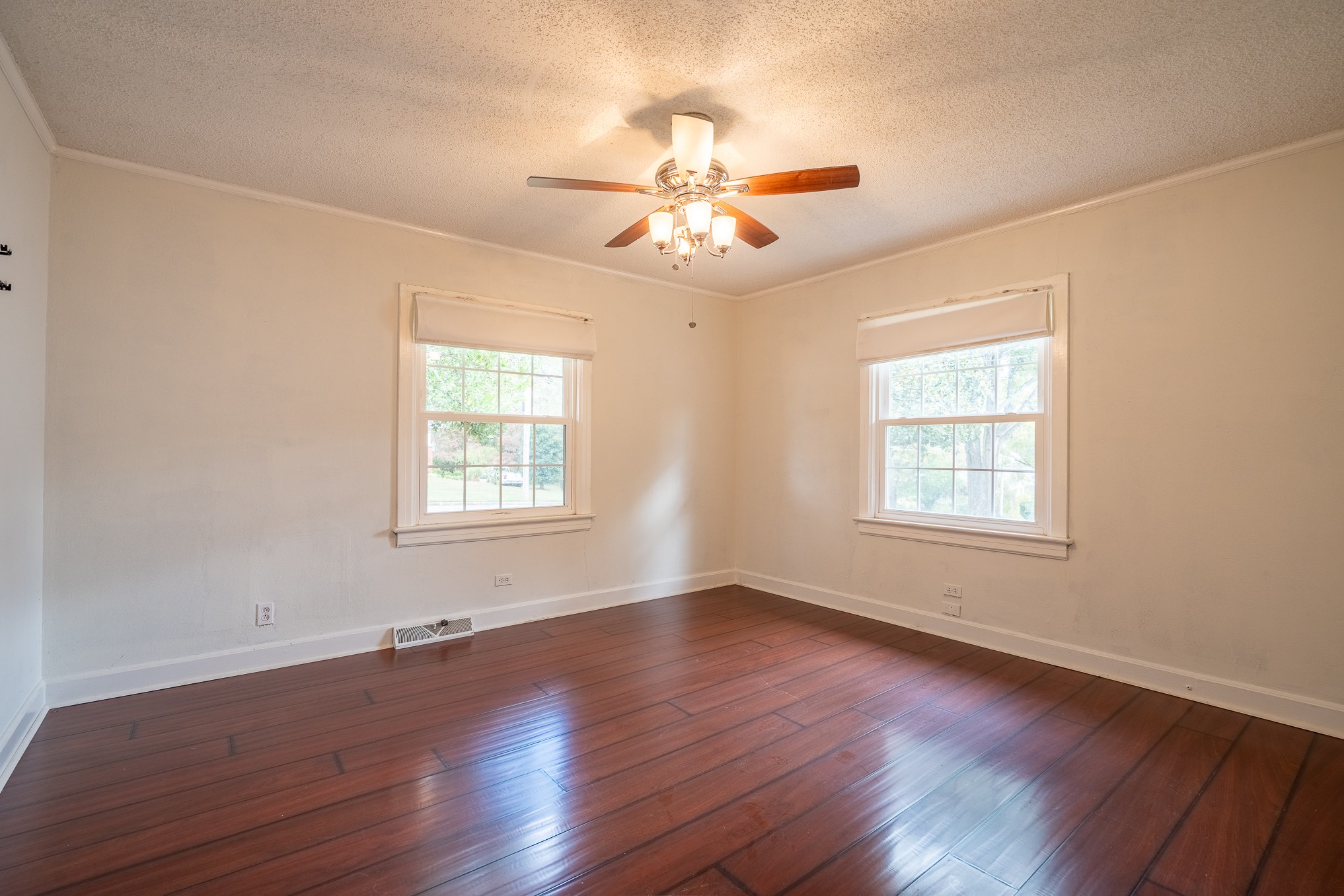 523 Highland Avenue Pulaski, TN 38478 - Photo 37 of 44 a view of an empty room with wooden floor and a window