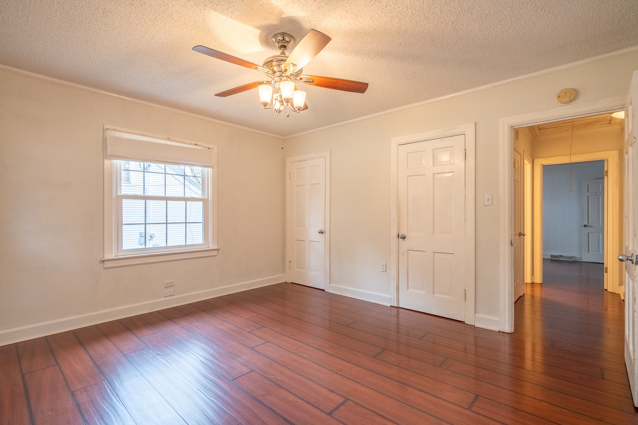 523 Highland Avenue Pulaski, TN 38478 - Photo 38 of 44 a view of an empty room with wooden floor and a window