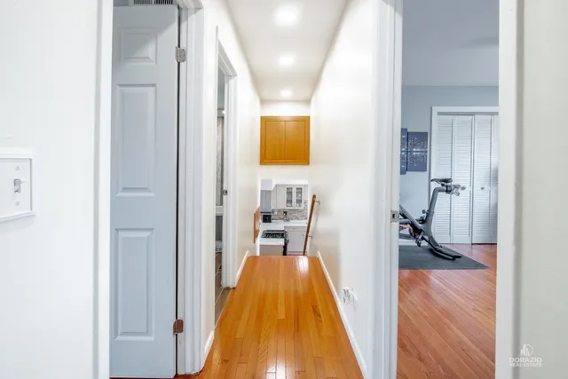 a view of a bedroom from a hallway