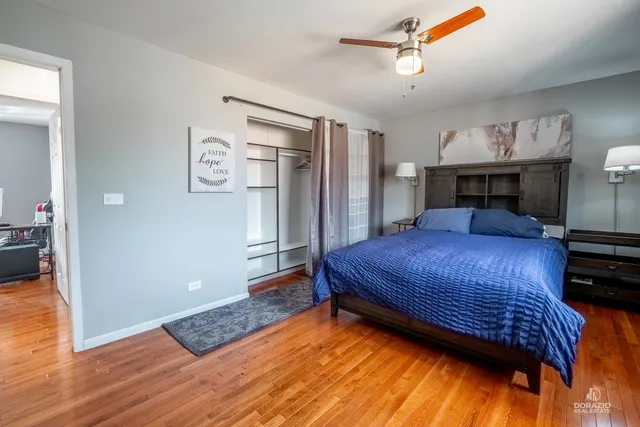 a bedroom with a bed and a mirror