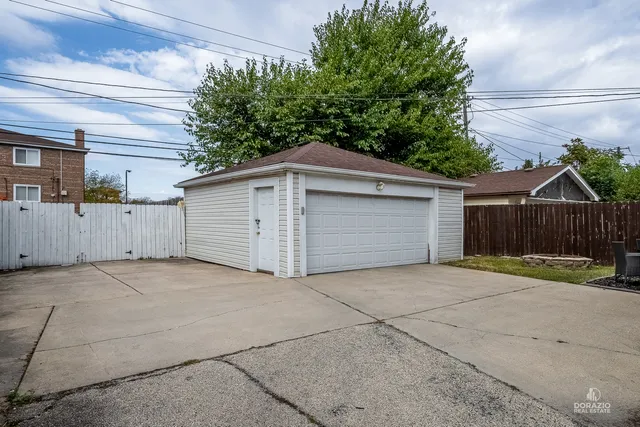 a view of a house with a yard and garage