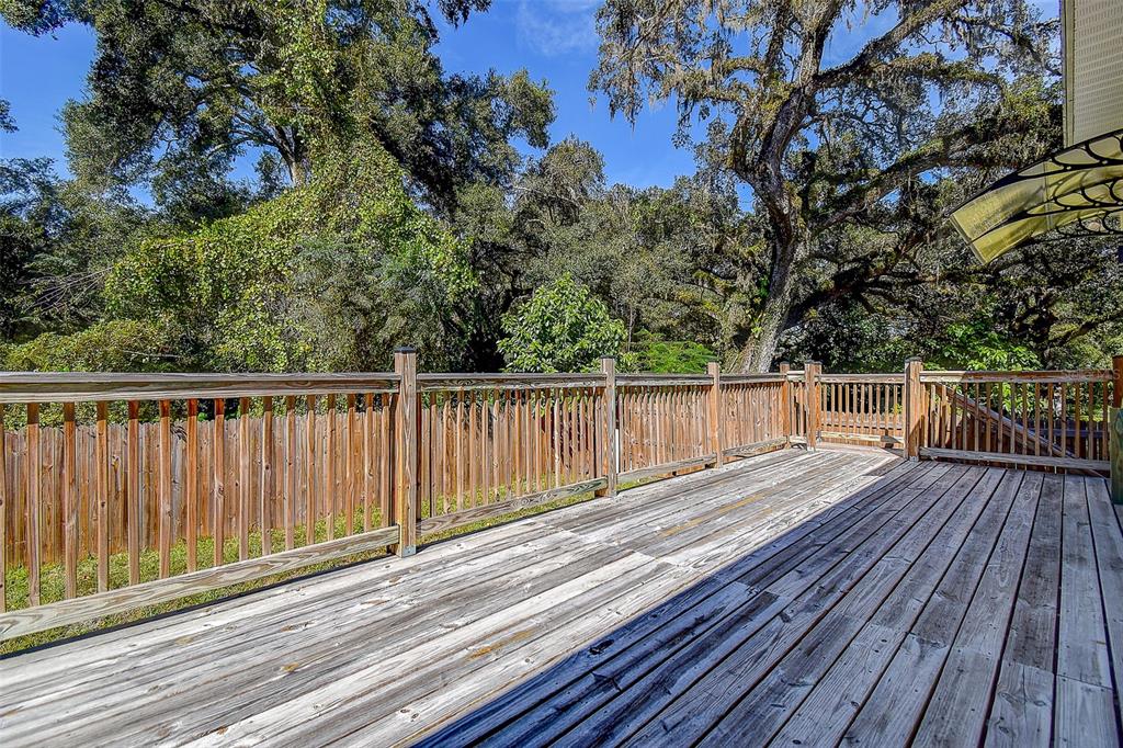 16519 US Highway 41 Spring Hill, FL 34610 - Photo 30 of 37 a view of deck with wooden floor and fence