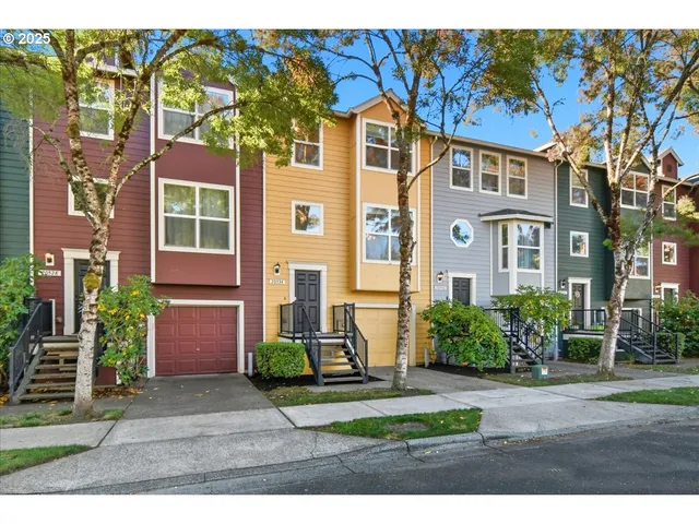 a view of a brick building next to a yard