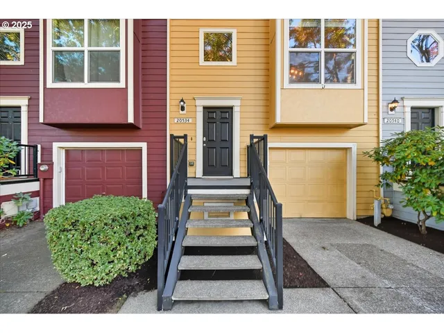 a view of front door of house with a yard